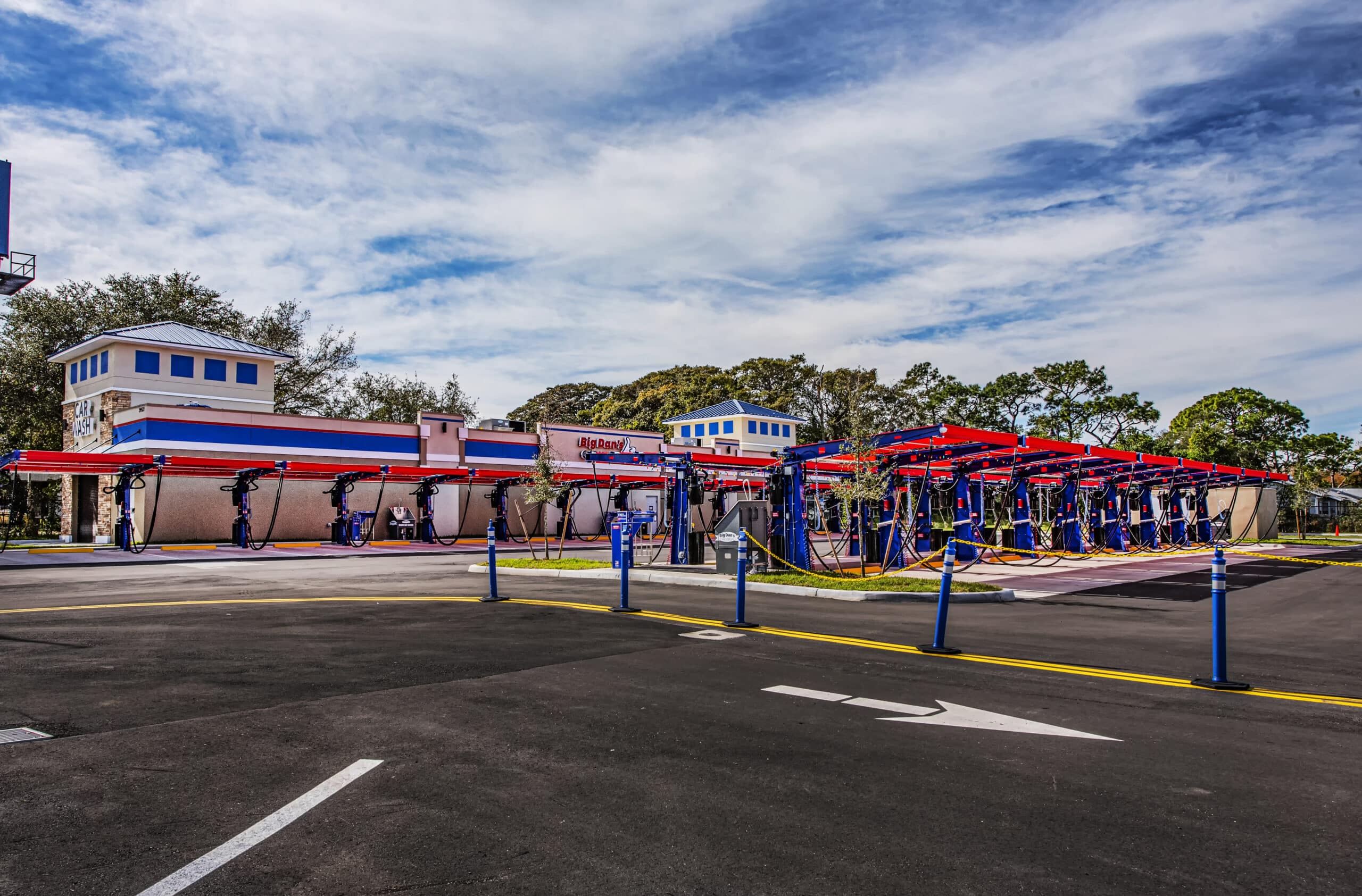 Exterior of Big Dan's Car Wash with all the car vacuum slots
